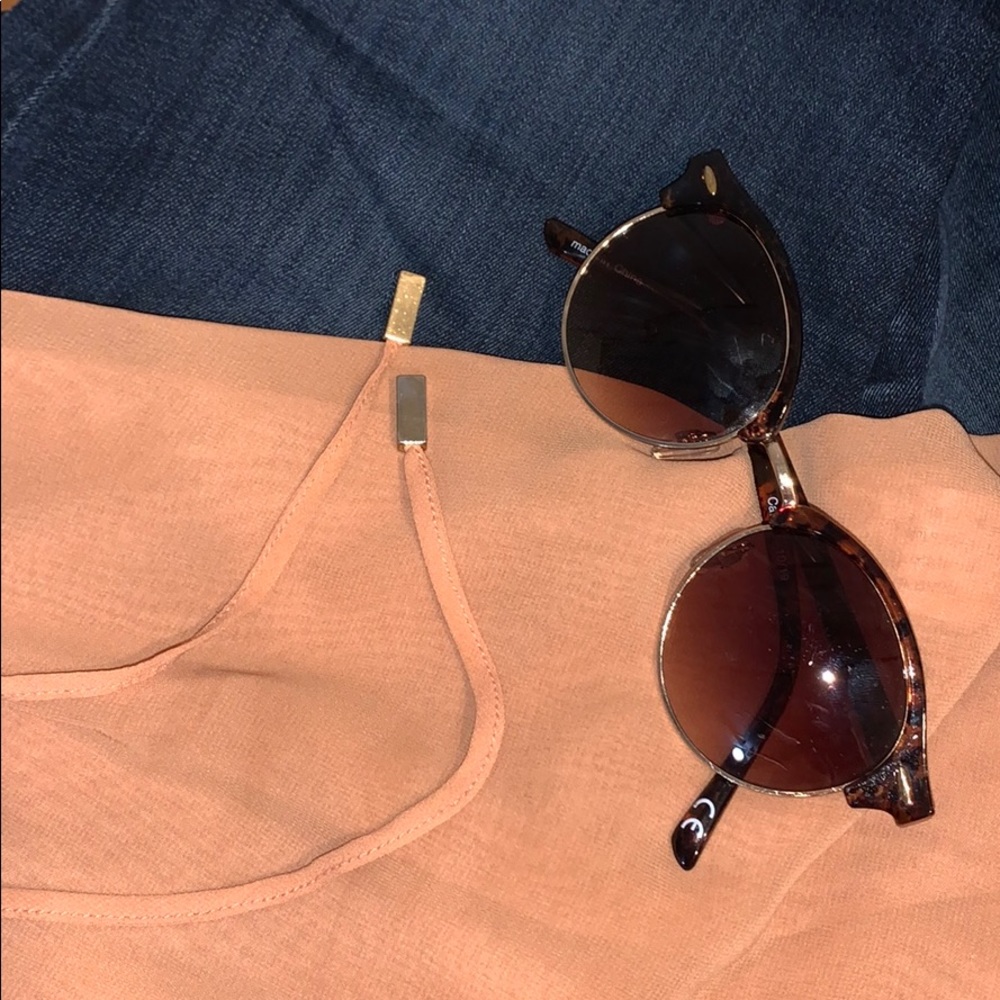 Tan halter top with partially open back.